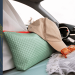 View of luggage stacked in the rear cargo area of a car, seen through the rear window, symbolizing a packed and ready-to-go journey.