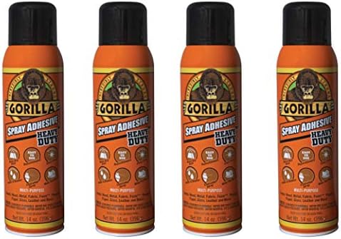 Image of the Gorilla Heavy Duty Spray Adhesive with its iconic gorilla logo and black-and-orange packaging. The product is displayed in a DIY setting with fabric and foam nearby to represent its versatile use.